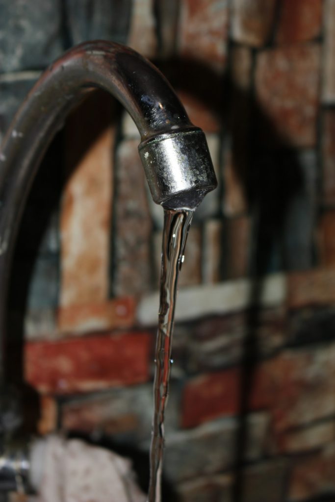 a-close-up-of-a-faucet-with-water-coming-out-of-it-s7evqvrswcs
